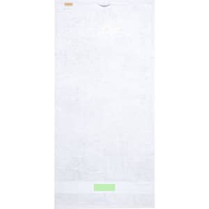 A white bath towel with a logo at the top and a band at the bottom in a light green colour.