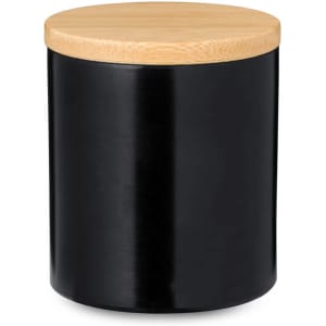 A black candle jar featuring a bamboo lid, designed for aromatic scents and home decoration.