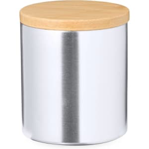 A silver aromatic candle jar with a wooden lid, designed for home and living use.