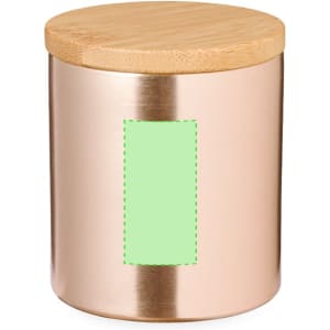 A metal candle jar in a rose gold colour with a bamboo lid and a blank green label on the front.
