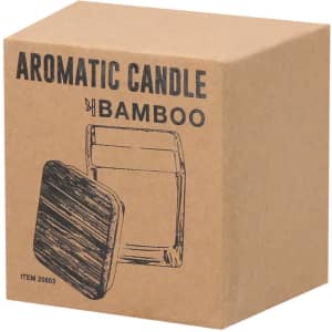 Aromatic candle packaged in a brown cardboard box featuring a simple design and a logo. The candle holder appears clear.