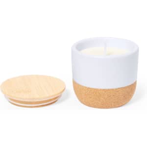 A white and cork aromatic candle with a wooden lid. The candle features a minimalistic design.