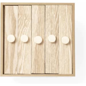 A wooden photo frame with a light timber finish featuring four rounded knobs for easy handling. It has a simple design with a natural aesthetic.