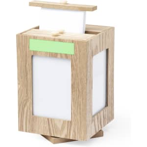 A wooden photo frame with a light finish, featuring two white display areas and a slot for photos or cards on top.