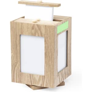 A wooden photo frame in a natural finish with white panels and a lid, featuring a logo on the side.