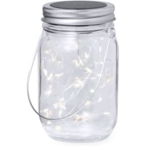 A glass jar lantern with a silver lid and a handle, filled with warm white fairy lights.