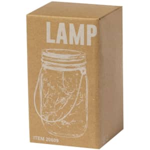 A lamp box featuring a jar design, with a handle, in a brown cardboard packaging. The box has a logo.