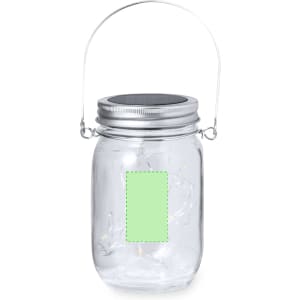 A clear glass jar lamp with a metal lid and handle, featuring a pastel green label.