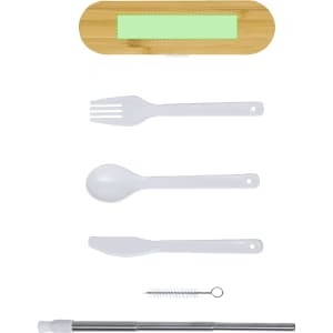 A bamboo case containing a white fork, spoon, knife, reusable straw, and cleaning brush.