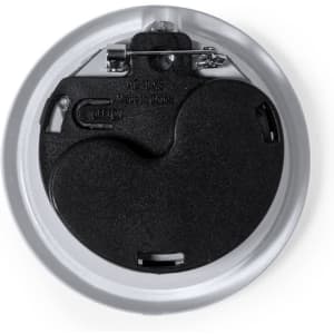 A circular lapel pin with a silver backing and a black attachment mechanism, designed for secure fastening.
