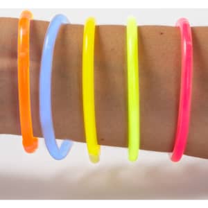 A collection of vibrant glow bracelets in orange, blue, yellow, green, and pink worn on an arm.