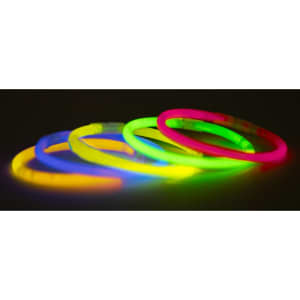 Glow bracelets in neon pink, green, yellow, and blue, displayed in a row against a dark background.