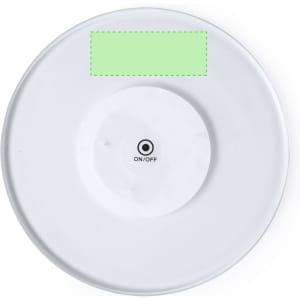 A circular white coaster featuring a central raised section with an on/off indicator.