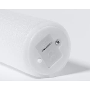 A white glow stick with a textured surface and a small battery compartment at the end. It has a logo on it.