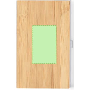 A wooden notebook with a bamboo finish, featuring a rectangular green patch on the front and a silver clasp.