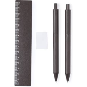 A brown ruler, two brown pens, and a small white square, all arranged neatly. The ruler features measurement markings.