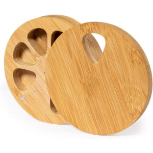 A round bamboo pillbox with two compartments, featuring a natural wood finish and a curved handle design.