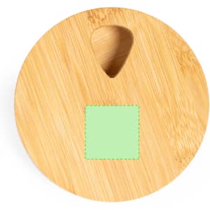 A round bamboo pillbox with a small triangular opening and a blank green square on top.