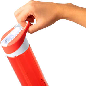 A drink bottle in vibrant red with a white lid, featuring a hand gripping the top for easy access.
