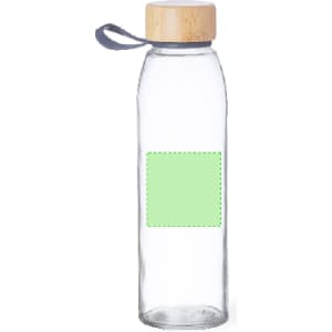 A drink bottle made of clear glass with a wooden lid and a grey strap, featuring a blank green label area.
