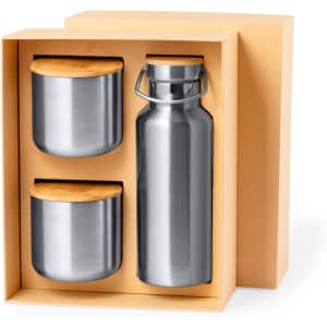 A drink bottle and two containers with bamboo lids, all in a cardboard box. The bottle is silver, and the containers are silver as well.