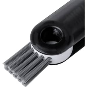 A drink bottle cleaner brush with grey bristles and a black handle, featuring a branding logo.