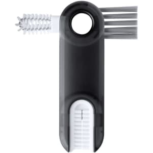 A drinkware cleaning brush in black and white, featuring bristles and a nozzle for effective cleaning.