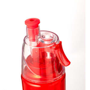 A drink bottle in vibrant red with a clear lid and nozzle, featuring a built-in dispensing mechanism.