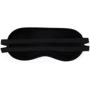 A black travel eye mask with adjustable straps and a logo, designed for comfort and relaxation.