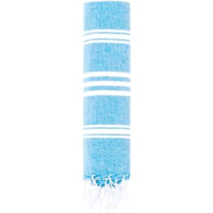 A blue towel pareo with white stripes and fringed edges, featuring a logo.