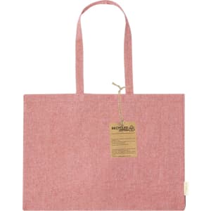 A pink tote bag made from recycled cotton, featuring two handles and a small tag.