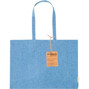 A blue tote bag with two handles and a tag attached, featuring a logo. Made from recycled material.