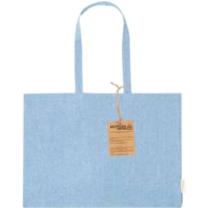 A blue tote bag with two handles and a tag. The bag is made from recycled cotton.