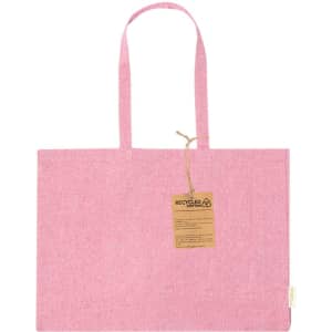 A pink tote bag made of recycled cotton with two handles and a tag attached.
