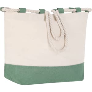 A tote bag in cream with a green bottom, featuring a rope handle and a structured design.