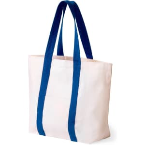 A tote bag in cream with blue handles and a simple design, featuring a logo on one side.