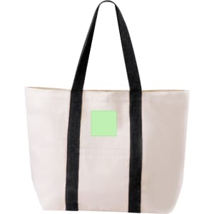 A cream tote bag with black straps and a square patch. Features a simple and functional design.