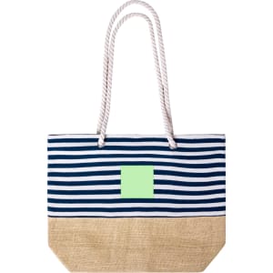 A striped tote bag in navy and white with a natural jute bottom, featuring a logo on the front.