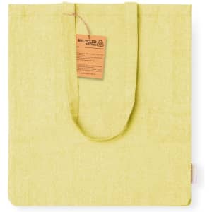 A yellow tote bag made from recycled cotton with a tag attached, featuring a simple and eco-friendly design.