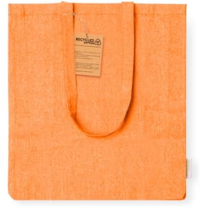 An orange tote bag made from recycled cotton with a tag attached. It features a single handle and a simple design.