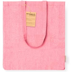 A pink tote bag made from recycled cotton, featuring a tag and a simple design.