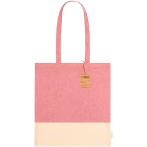 A tote bag in pink chambray with a cream bottom, featuring two handles and a branding logo.