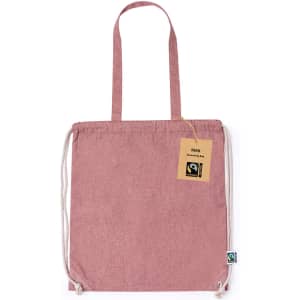 A pink Fairtrade drawstring bag with a logo tag, featuring sturdy drawstrings and shoulder straps.