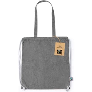 A grey Fairtrade drawstring bag with a tag and straps, featuring a logo on the side.