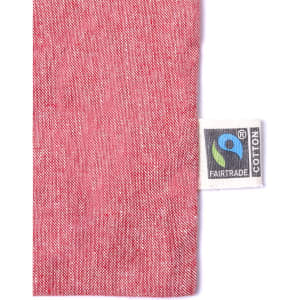 A pink tote bag with a texture detail and a Fairtrade label.