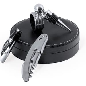 A wine set with a silver corkscrew, stopper, and pourer, displayed in a round black storage case.