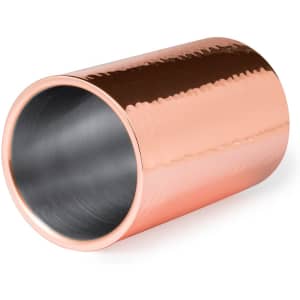 A drink bottle cooler in a shiny copper finish with a smooth inner lining. It features a simple, modern design and has branding.