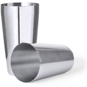 A stainless steel cocktail shaker set featuring a shiny finish, including two tapered cups. One is upright while the other is tilted.