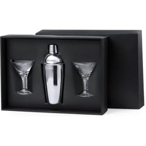 A cocktail set featuring a shiny silver shaker and two clear martini glasses, presented in a black box.