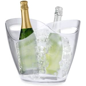 A clear ice bucket containing two bottles of champagne, surrounded by ice. The bucket has a stylish, curved design.